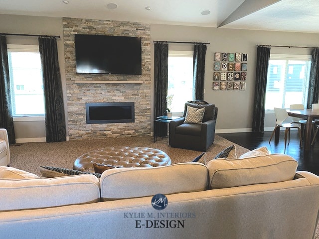 Sherwin Williams Anew Gray, stacked stone ledgestone fireplace. Best greige. Kylie M Interiors Edesign, online paint color consulting advice. Beige carpet and gallery wall