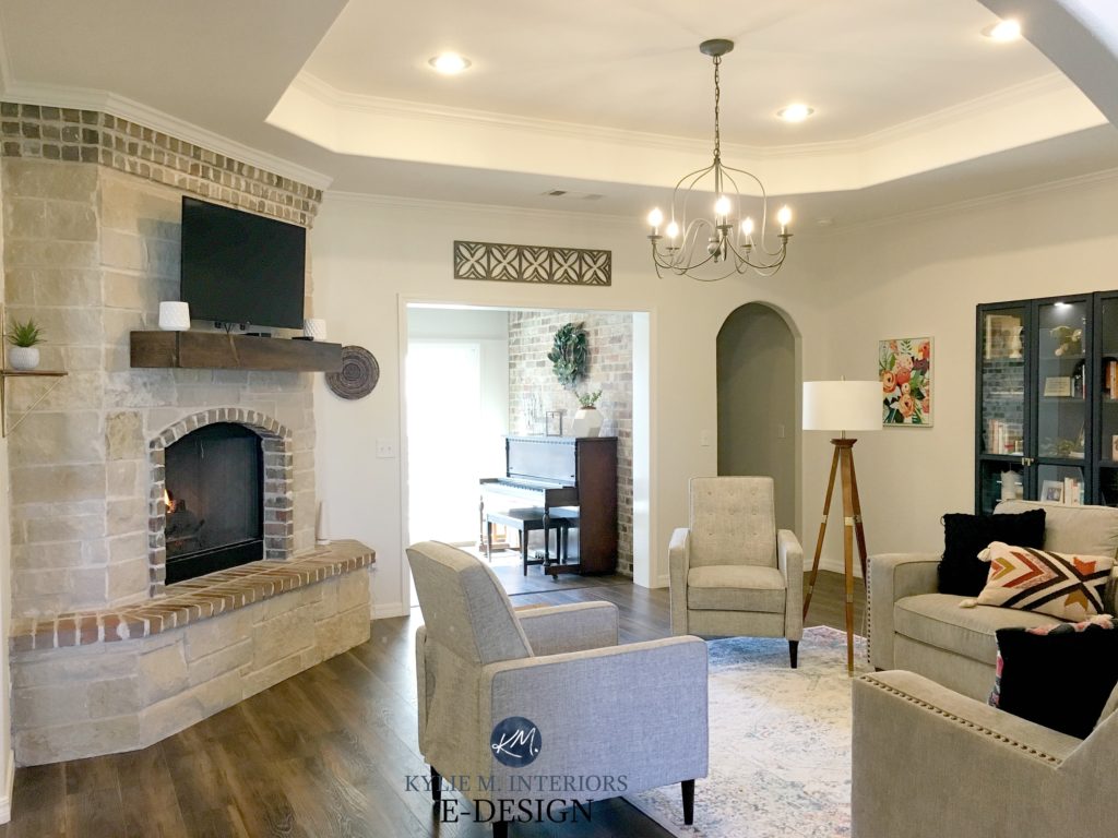 Sherwin Williams Pearly White withe limestone style stone corner stone fireplace, ccent chairs, tray ceiling. Kylie M Interiors, best paint colour specialist. jpg