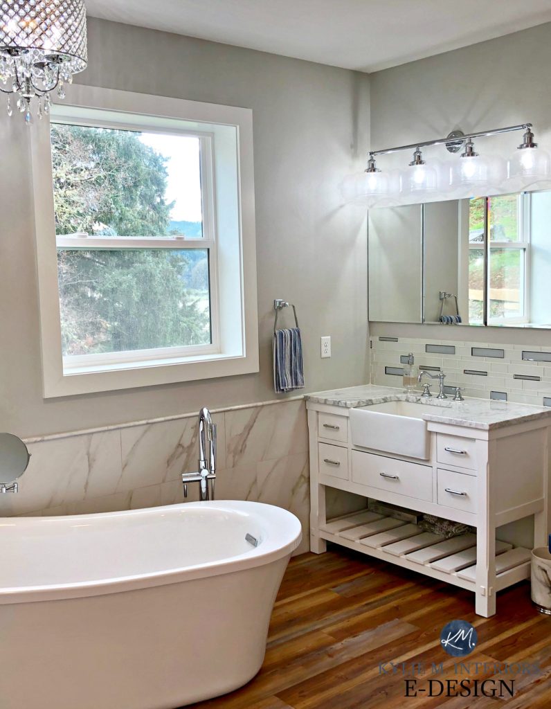 Sherwin Williams Big Chill best gray paint colour in bathroom, white vanity and freestanding tub, marble look tile wall. Kylie M Interiors Edesign