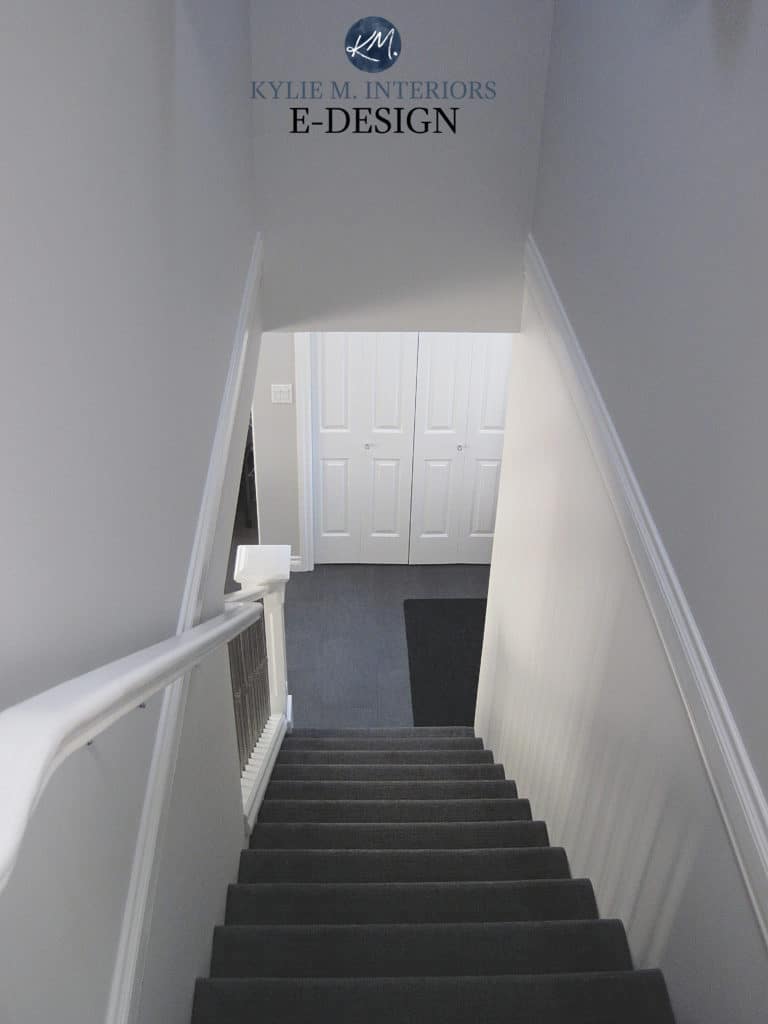 Sherwin Williams On the Rocks, best cool gray paint colour. In dark stairwell hallway with Pure White trim. Kylie M Interiors Edesign. Carpet on stairs