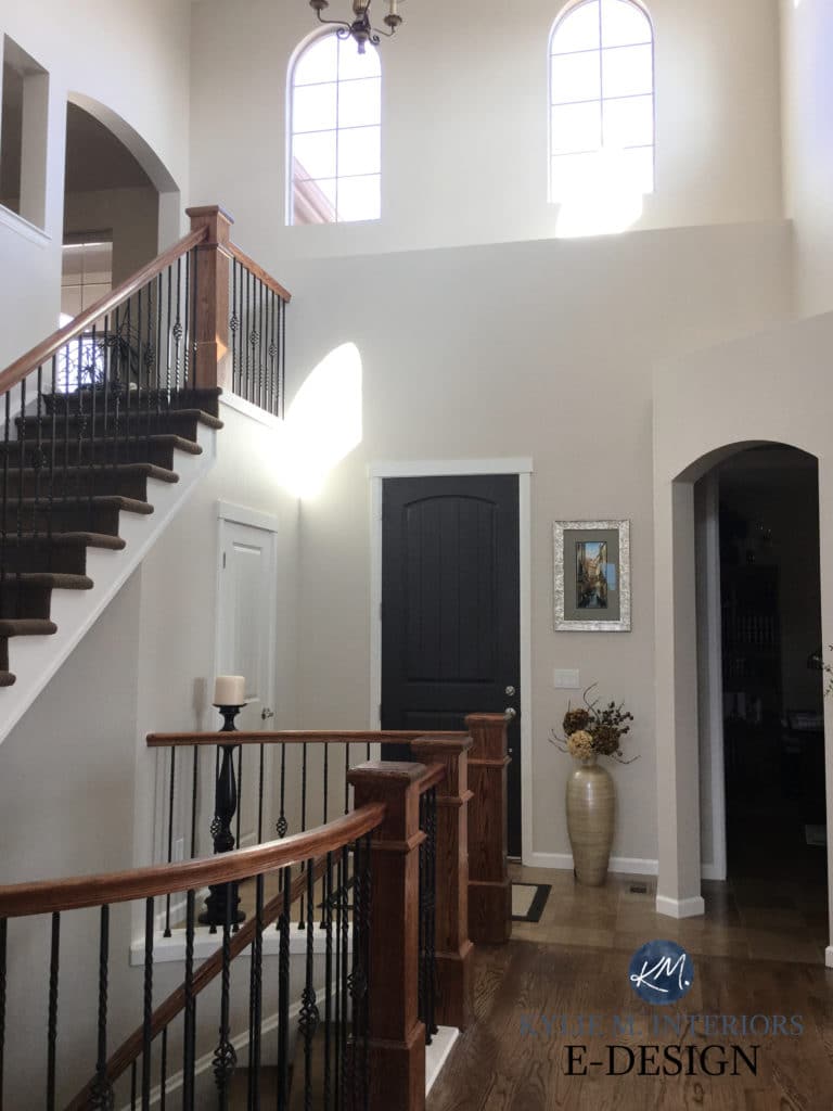 Entrway, 2 storey foyer in Sherwin Williams Canvas Tan, wod floor. Black Fox front door and staircase. Kylie M Interiors Edesign, diy decor and design blogger