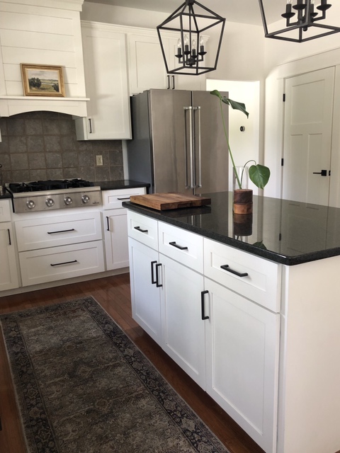 Kitchen update ideas, Sherwin Williams Alabaster, dark black granite countertops, backsplash tile, white cabinets. Kylie M diy E-design
