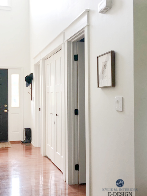 Sherwin Williams Alabaster, warm white paint colour with red pink hue oak flooring in hallway with doors. Kylie M Interiors Edesign, diy decorating
