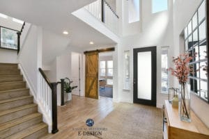 2 storey entryway or foyer, white walls, Sherwin Williams Pure White, black front door, wood stairs, sliding barn door. Kylie M Interiors Edesign, online paint colour, virtual diy decorating ideas