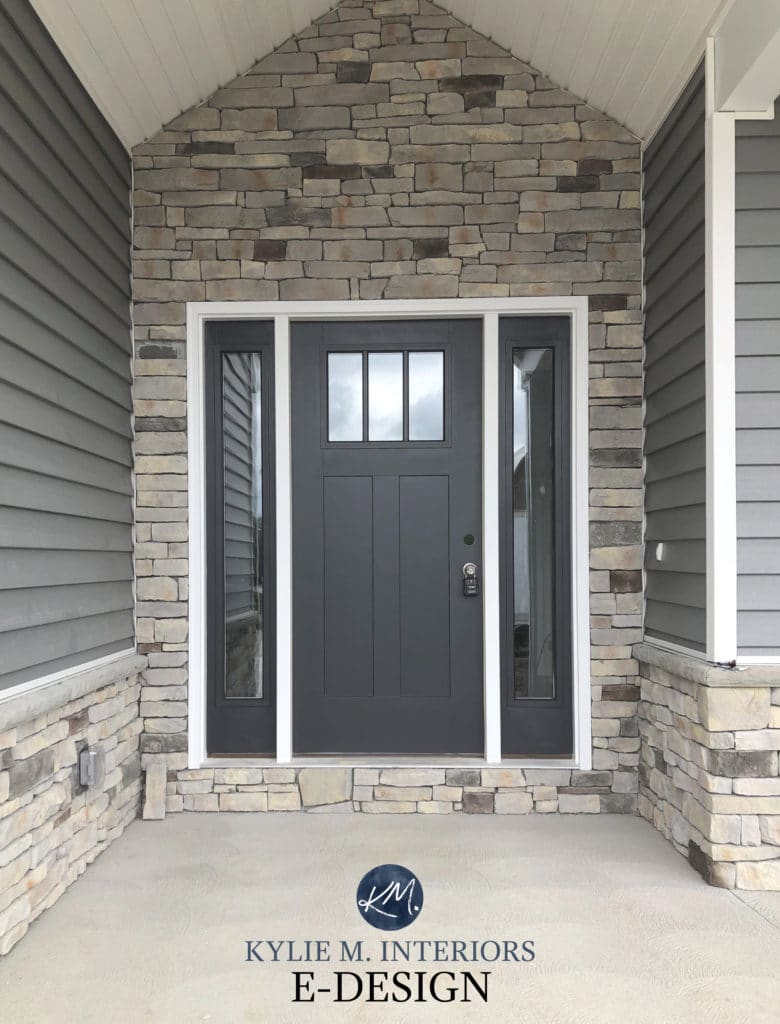 Benjamin Moore Cheating Heart, dark navy blue black front door paint colour with stone and gray siding. Kylie M Interiors Edesign