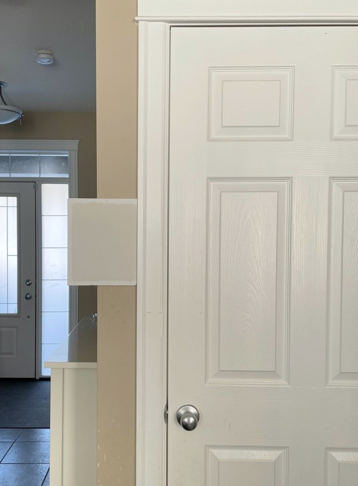 Sherwin Williams Aesthetic White off white beige paint color with white trim and door simila to Pure White
