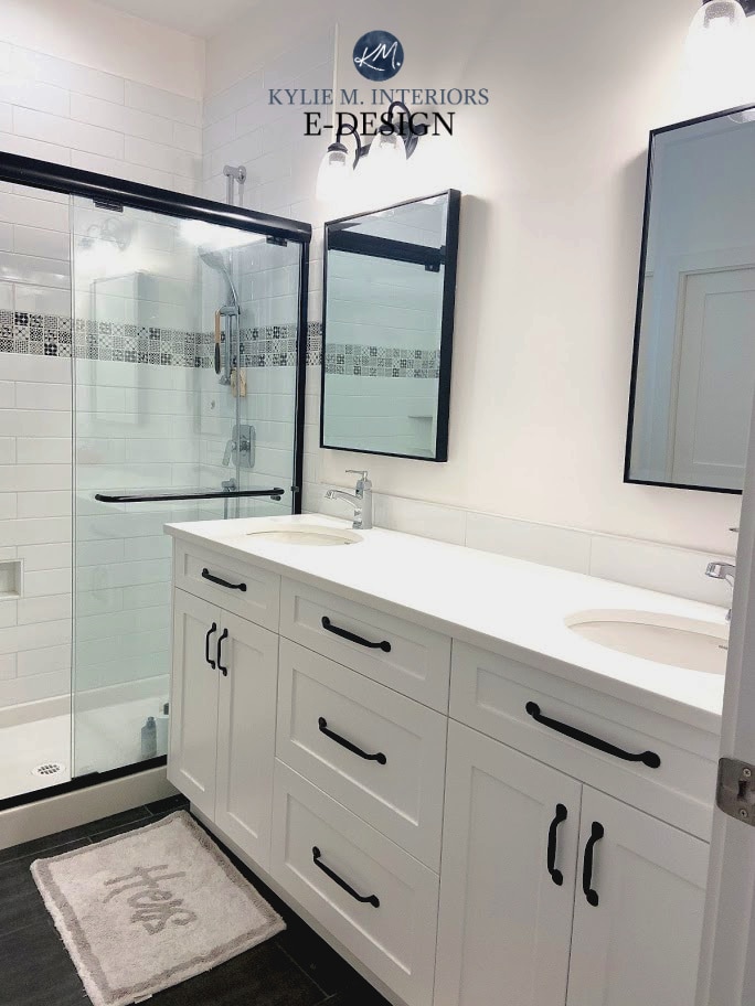 Modern farmhouse bathroom in Benjamin Moore Super White. White tiles and vanity, quartz, walk in shower, black faucet, accents. Kylie M Interiors Edesign, online diy decor blog