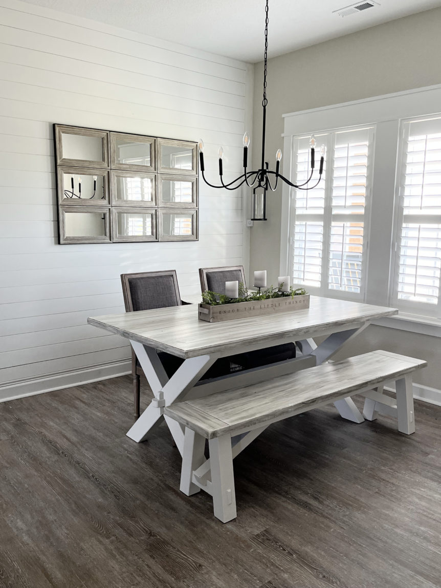 Sherwin Williams Pure White shiplap feature wall in dining room, Agreeable Gray greige walls, modern farmhouse style, graywash LVT wood look floor.