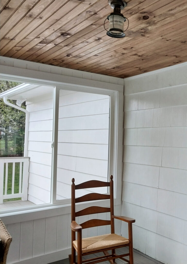 BEnjamin Moore White Dove on exterior siding and interior sunroom with wood ceiling. Kylie M Interiors Edesign, client photo
