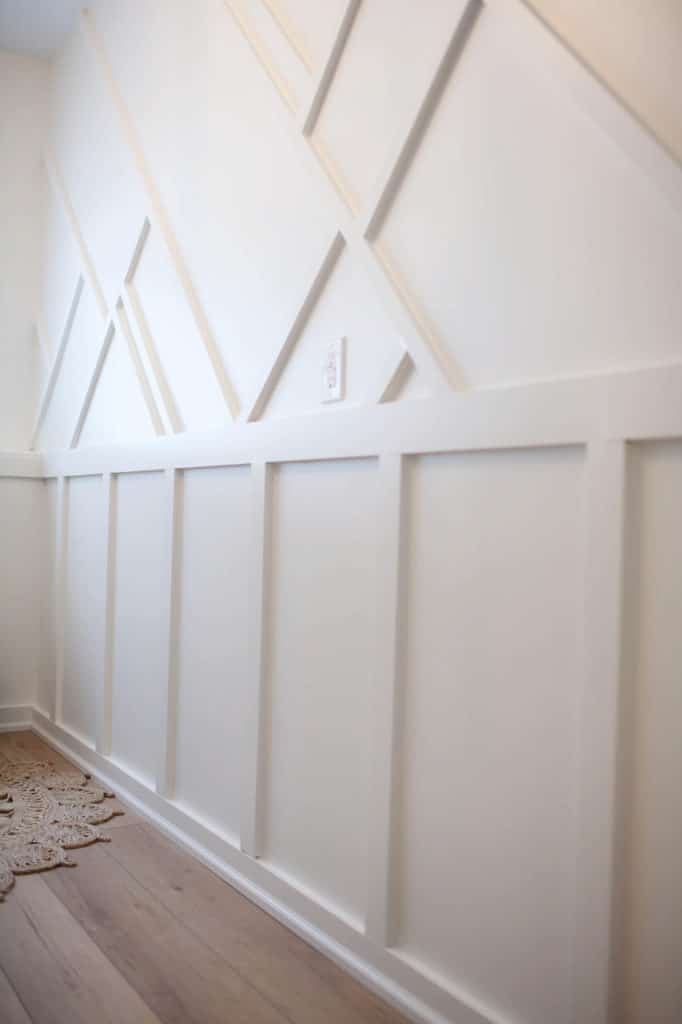Feature wall with moulding, board and batten and design in Benjamin Moore White Dove. DIY decor and design consultant, Kylie M Interiors Edesign, client photo