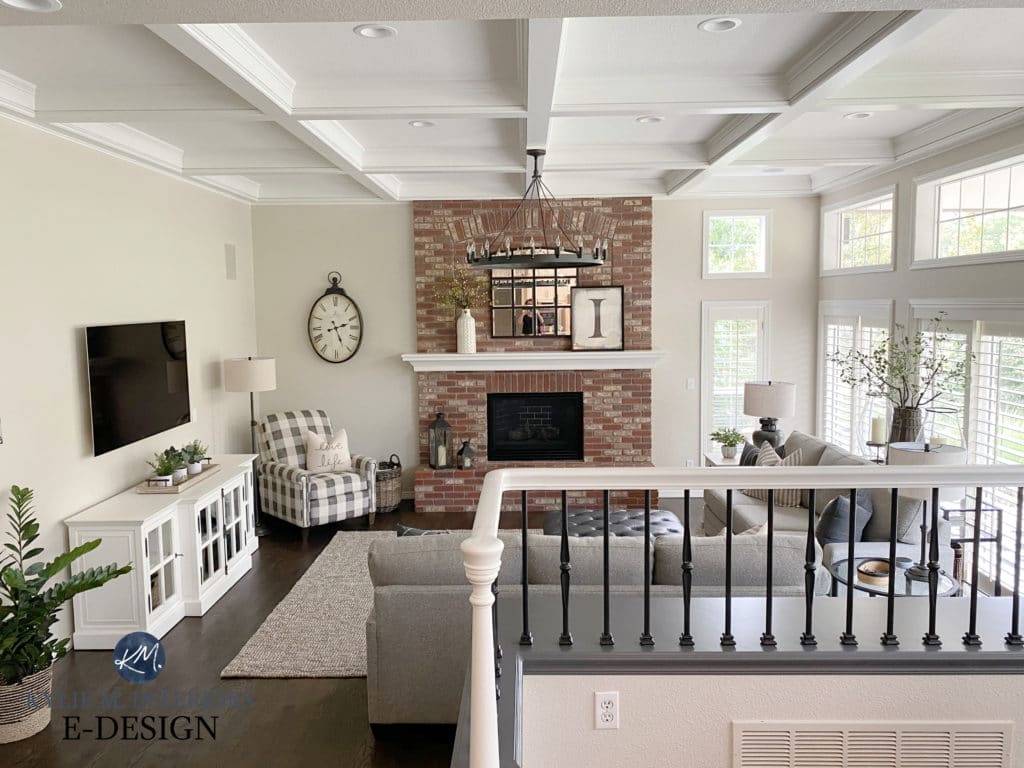 Split-level family room with transitional style home decor and furniture. Red, pink brick fireplace and greige walls, white trim. Kylie M Interiors Edesign. Benjamin Edgecomb, White