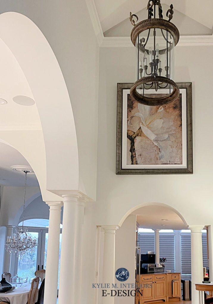 Benjamin Moore White Dove, a popular warm white in a foyer hallway with arched doorways and high ceiling. Kylie M Interiors Edesign