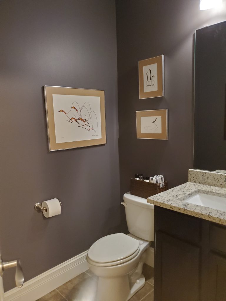 Sherwin Williams Gauntlet Gray, dark grey paint colour in small bathroom with granite countertop, beige tile floor. Kylie M Interiors Edesign