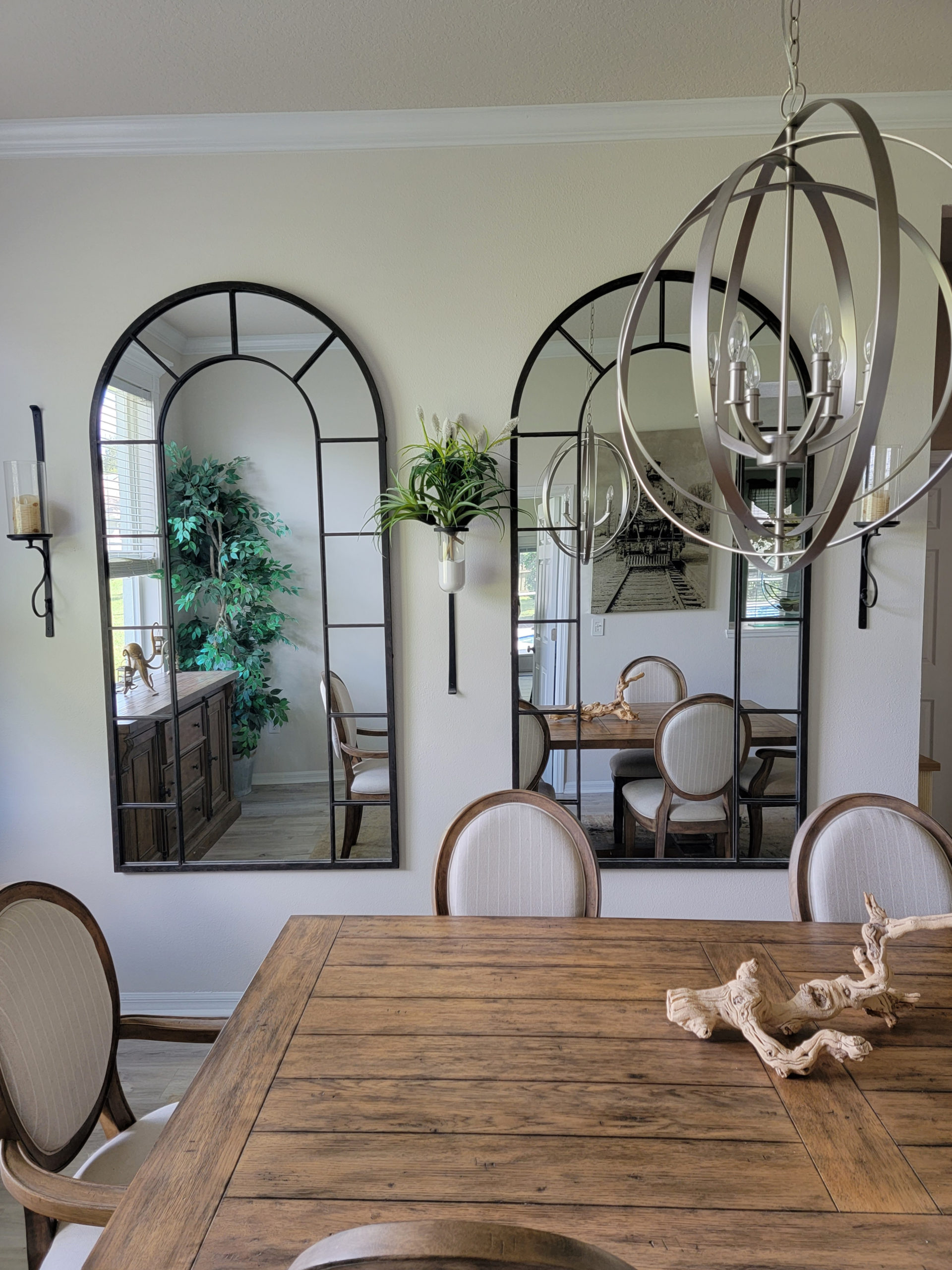 Warm off-white paint colour, similar to Benjamin Moore Ballet White. Shown in dining room, arched mirrors. Kylie M Interiors CLIENT PHOTO