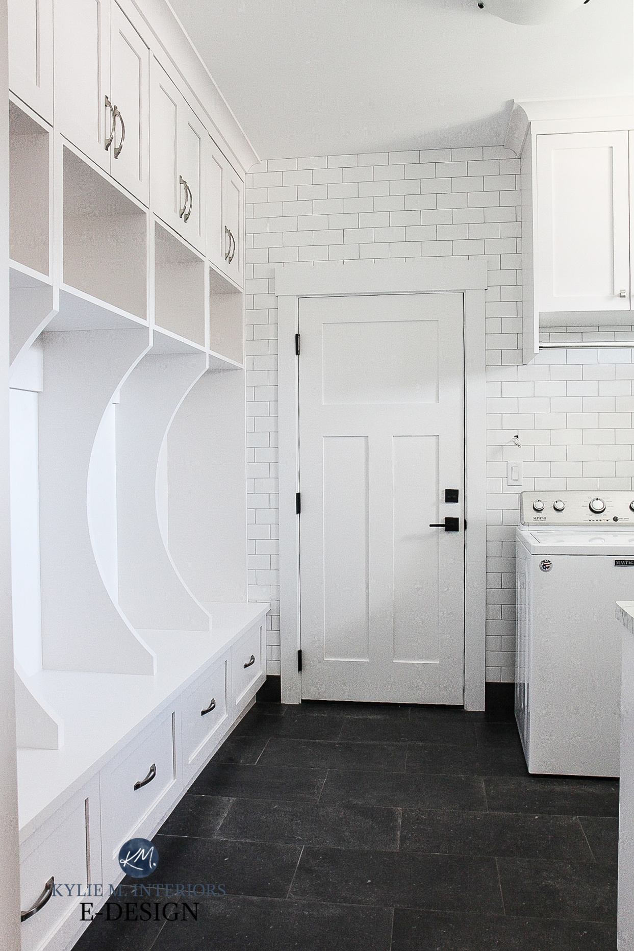 White laundry room with mud room built-in benchs, hooks, cubbies, white subway tile, gray tile floor. Sherwin Williams High Reflective White, Kylie M Interiors online paint color consultant