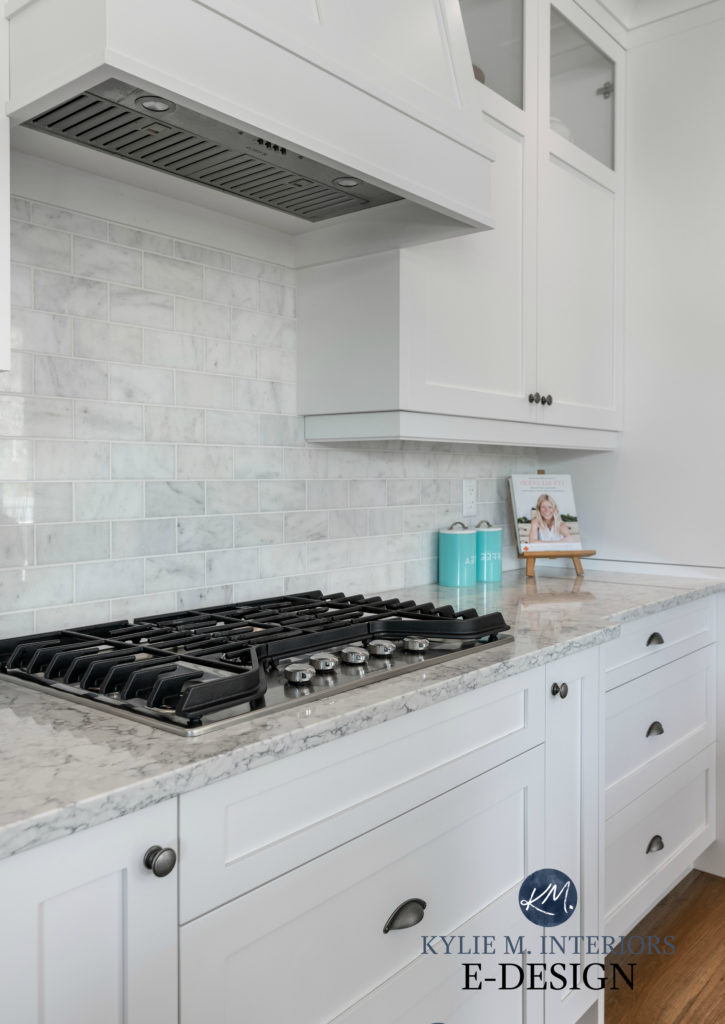 Kitchen with painted cabinets, marble subway tile backsplash, OAK FLOOR, Sherwin Williams white cabinets, LG quartz countertop, . Kylie M INteriors Edesign, online paint colour consulting