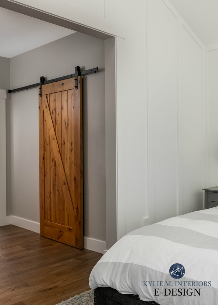 Sherwin Williams High Reflective White in bedroom with Stonington Gray in hallway with wood sliding barn door to closet. Kylie M Interiors Edesign, online paint color consulting