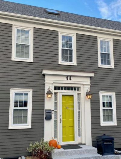 Benjamin Moore Dragons Breath painted exterior siding, chartreuse green front door, cream trim. Kylie M INteriors edesign
