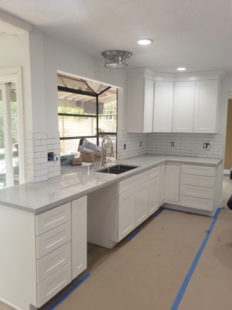 Benjamin Moore Chantilly Lace, best painted white cabinets, gray quartz countertop, white subway tile, white walls. Kylie M Interiors Edesign, client photo