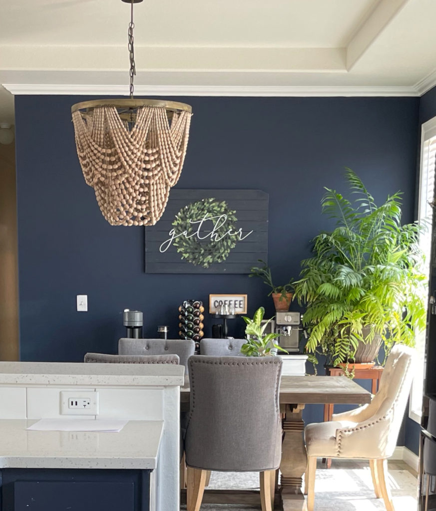 Blue Endeavour, best navy blue paint colour in dining room with beaded chandelier. CLIENT PHOTO, Kylie M Interiors Edesign