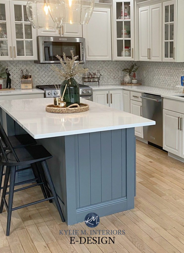 Cherry kitchen cabinets painted Benjamin Moore Classic Gray, best off-white warm gray paint color. White quartz, Roycroft Pewter painted island, white oak floor. Kylie M Interiors Edesign