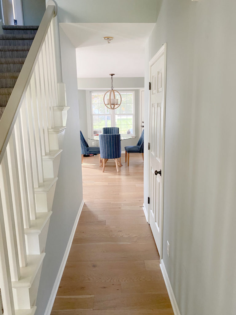Hallway in Sherwin Williams Austere Gray, Pure White trim, warm wood oak flooring. CLIENT PHOTO, Kylie M Interiors Edesign, best gray green paint colours