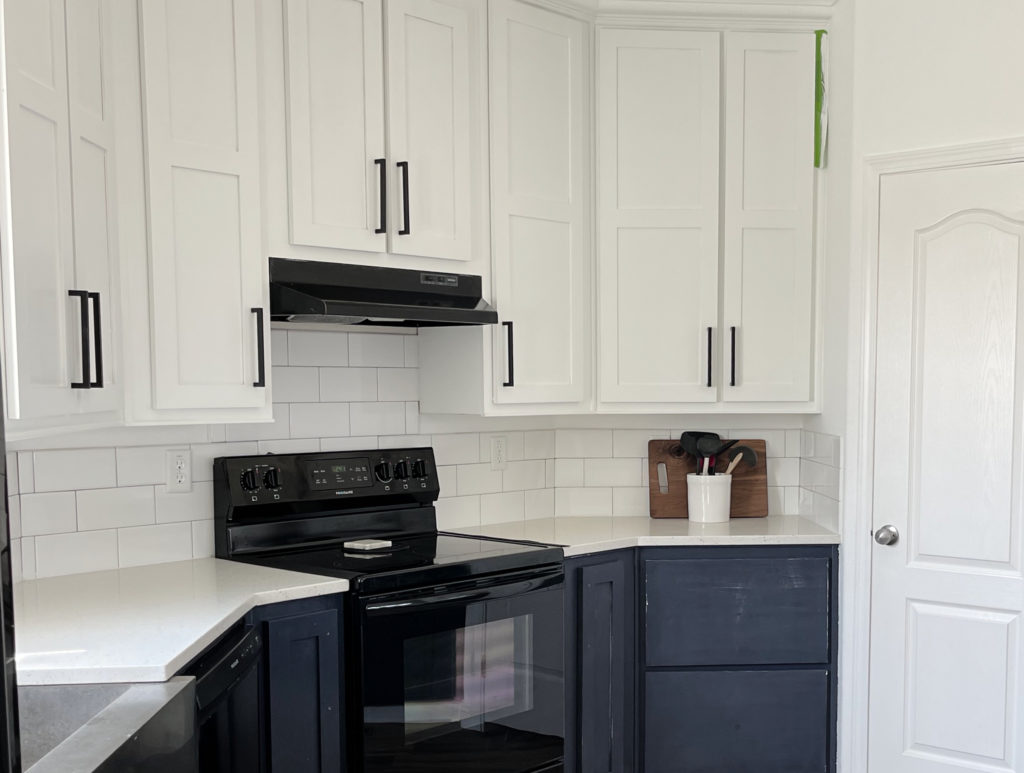 Sherwin Williams Extra White painted cabinets, white subway tile and quartz countertops, Endeavor Blue lower cabinets. CLIENT PHOTO Kylie M Edesign, online paint color consultant