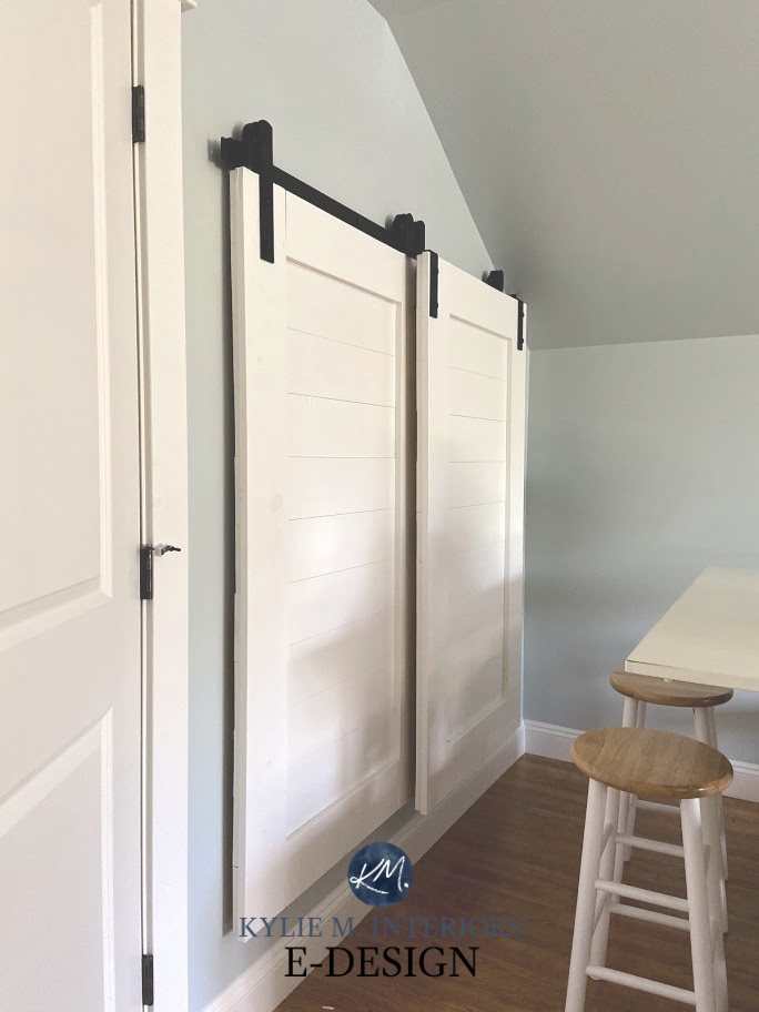 Sherwin Williams Sea Salt, Benjamin Moore Cloud White trim, sliding barn doors in playroom covering toy storage. Kylie M Interiors Edesign, best blue green gray paint colours