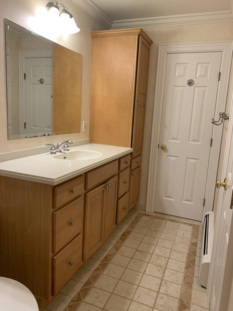 Bathroom maple cabinets beige peach terra cotta tile floor before edesign