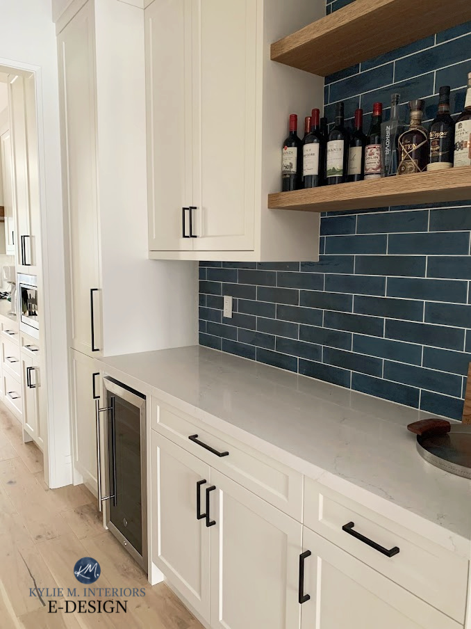 Butlers pantry with blue subway tile backsplash, wood floating shelves, Benjamin Moore White Dove shaker style painted white cabinets. KYlie M INteriors Edesign