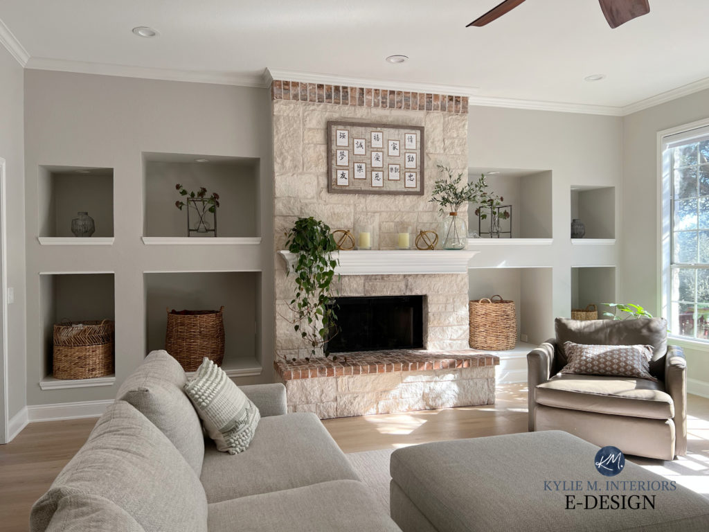 Living room or family room, stone fireplace that's beige with Sherwin Williams Crushed Ice grey paint colour walls, Pure White trim and mantel. Kylie M Interiors Edesign