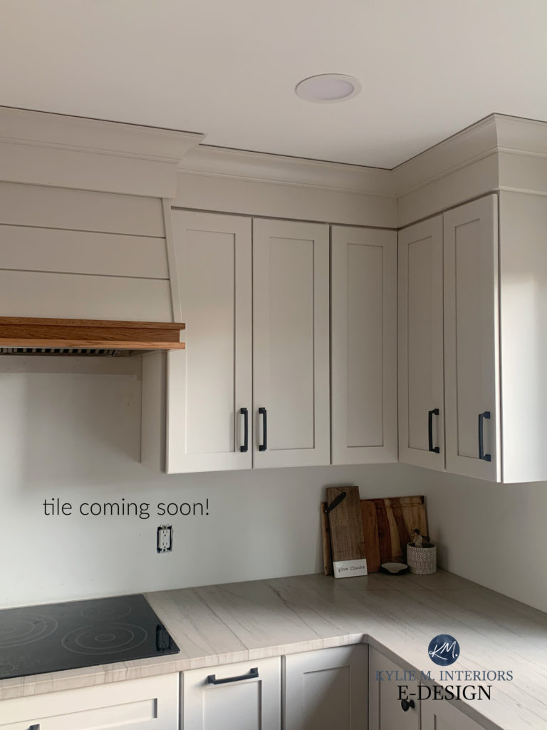 Sherwin Williams Agreeable Gray best paint colour for off-white greige taupe warm kitchen cabinets, White Macaubus quartz countertops, black hardware. Kylie M Interiors Edesign, diy update idewas