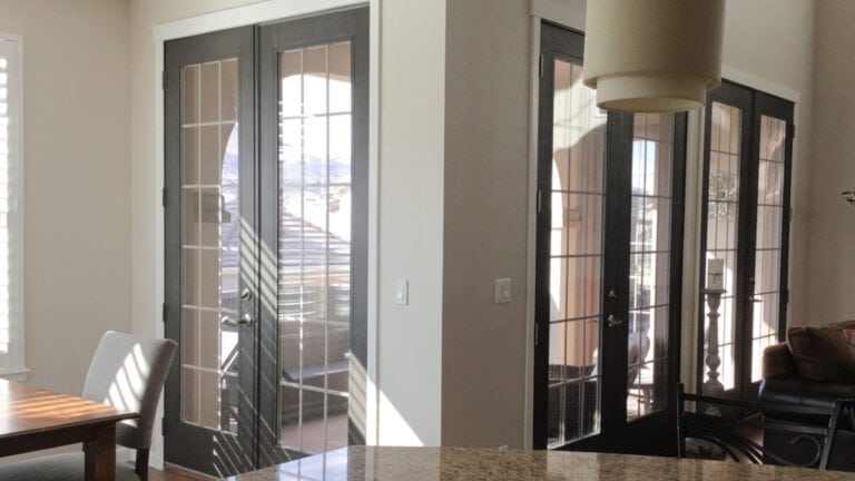 Sherwin Williams Canvas Tan walls with iron Ore (black) interior french doors