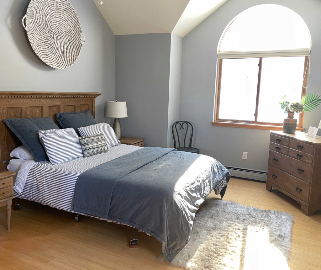 Benjamin Moore Coventry Gray best gray paint colour, wood floor, wood trim and headboard. Client photo, Kylie M Interiors Edesign