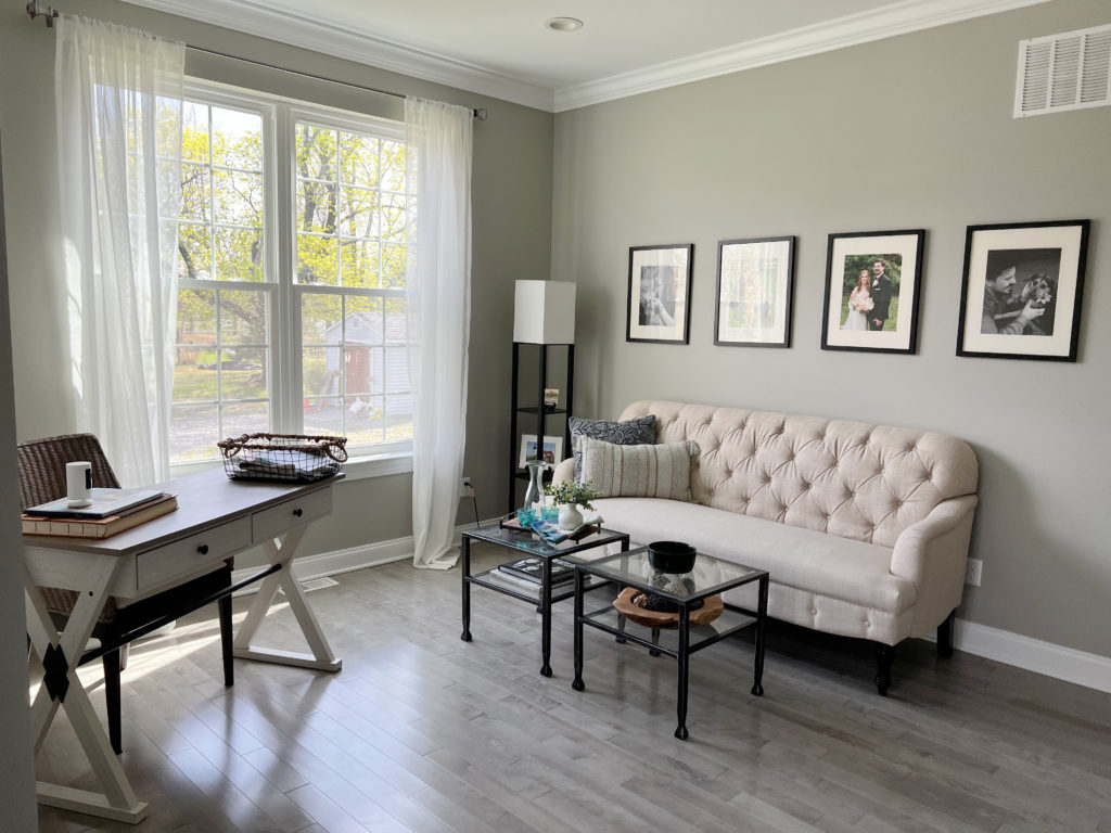 Best warm gray paint colour, Sherwin Williams Mindful Gray with gray wash wood floor and neutral furnishings