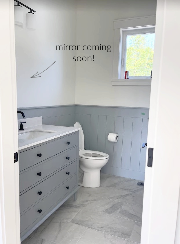 bathroom with Sherwin Williams Network Gray shiplap, vanity, gray and white tile marble look floor, black fixtures, Benjamin White Dove walls. Kylie M. (1)
