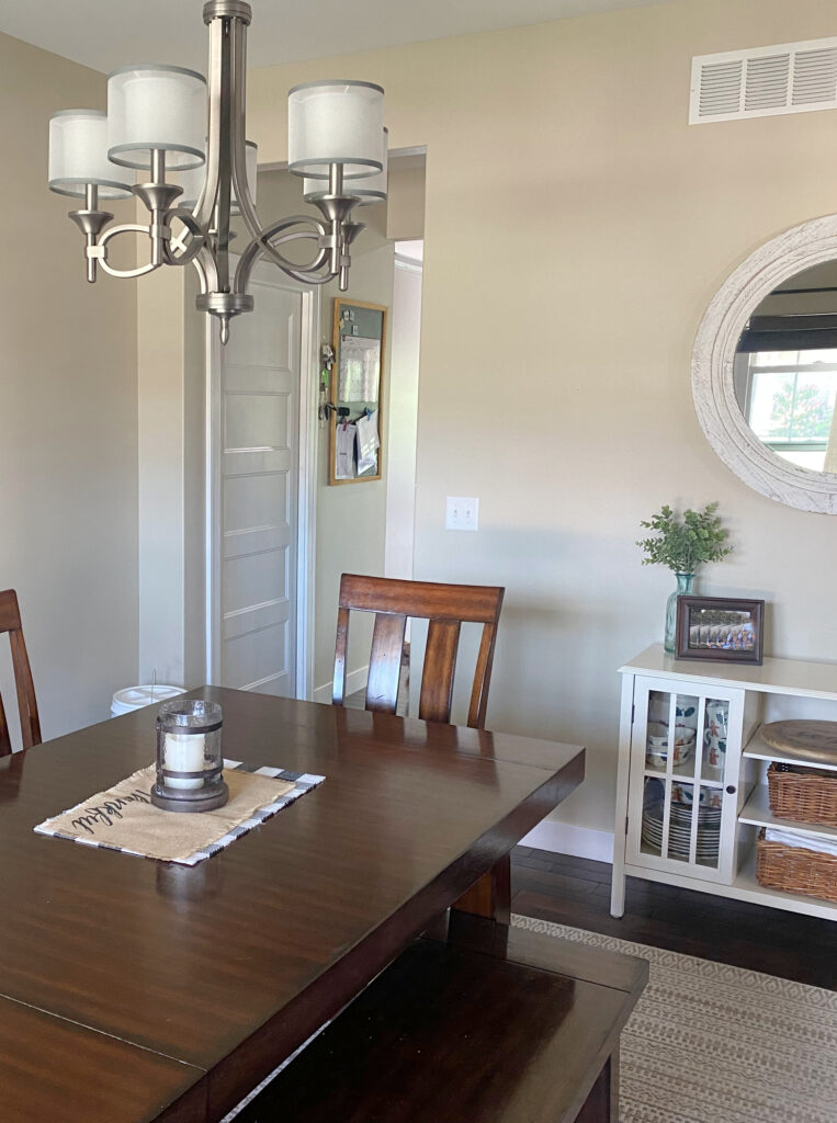Benjamin Moore Grant Beige, popular beige tan paint colour, dining room with dark wood furniture, home decor