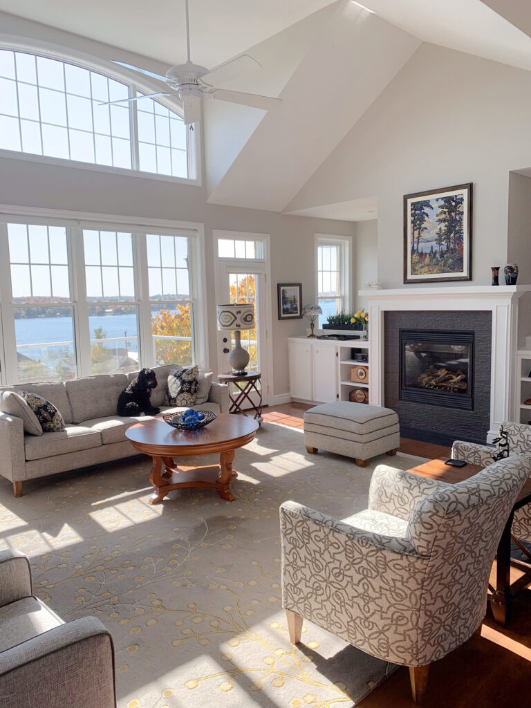 Ocean or lake home, Sherwin Williams Agreeable Gray, vaulted ceiling in living room with neutrals. Kylie M.