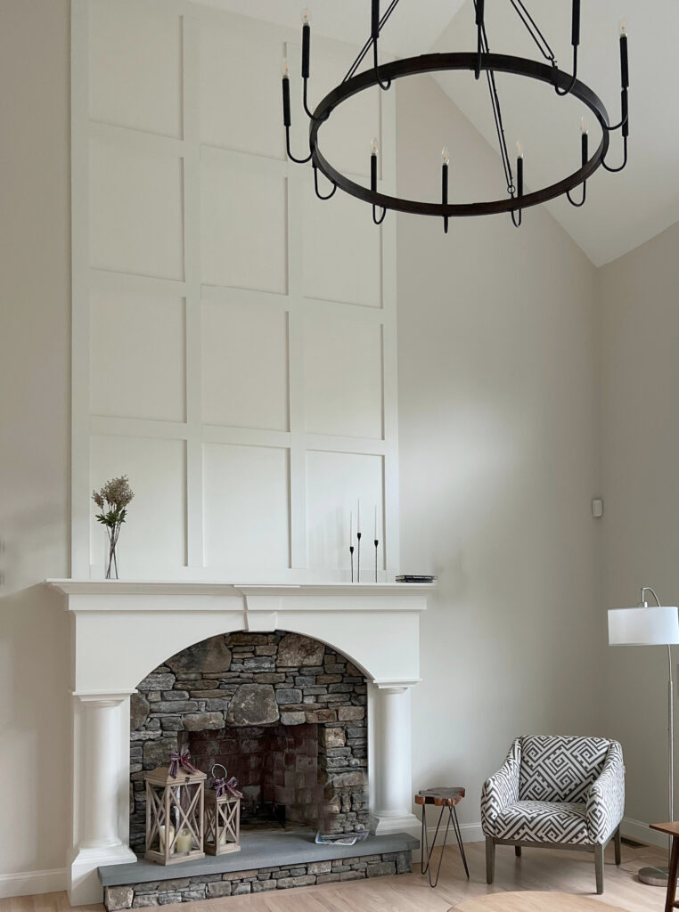 White Duck and Simply White, BEnjamin and Sherwin, vaulted fireplace with mouldings and brown stone.