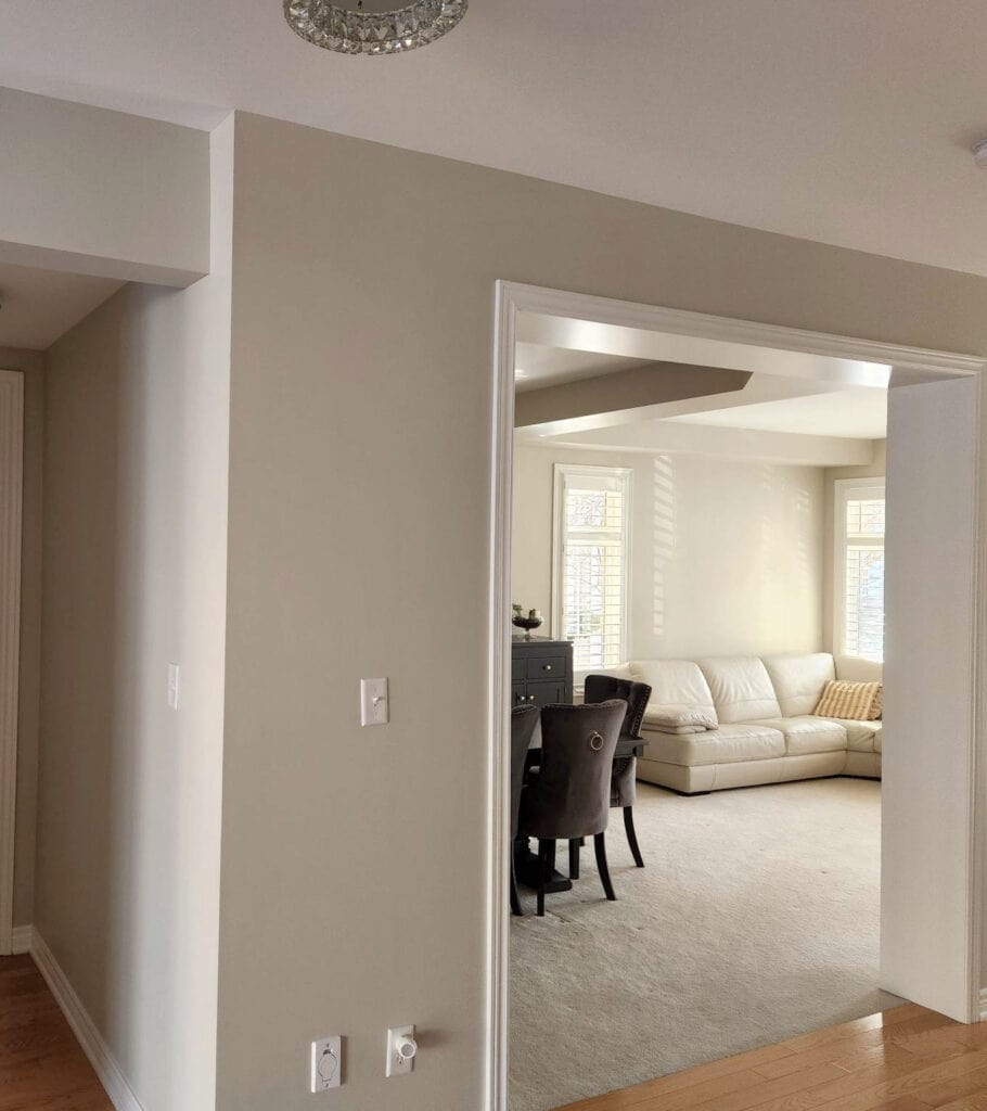 Benjamin Moore Natural Cream in east and west facing rooms, beige neutral carpet, white oak floor. Warm neutral paint color. Kylie M Edesign, leather sofa