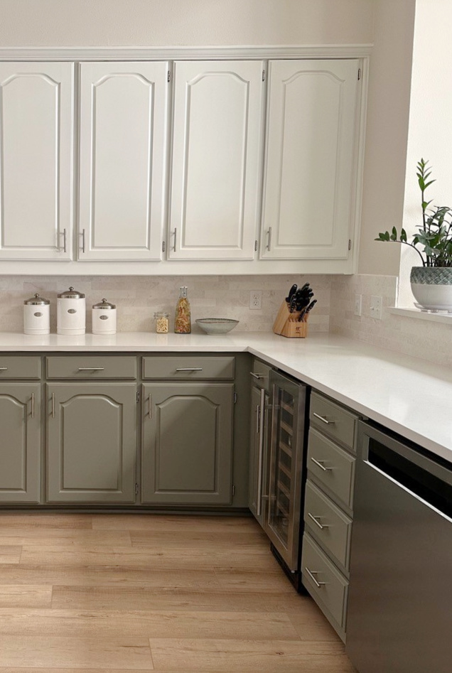 Painted maple kitchen cabinets. Benjamin Moore White Dove upper, Antique Pewter green lower cabinets. Maritime White beige walls, white quartz. Kylie M Edesign