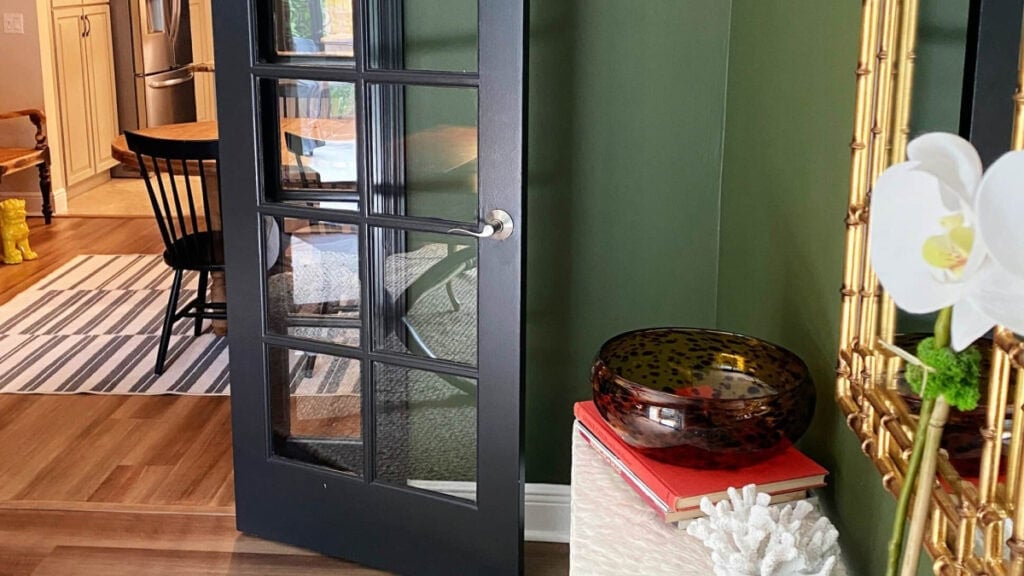 Sherwin Williams Tricorn Black painted french door in home office painted Secret Garden (green)