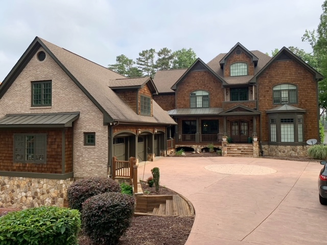 Sherwin Williams Thunder Gray trim, l-shape house, garages, wood shakes, asphalt roof, pink toned drivway, brick and stone. Kylie M Interiors ONline paint color consulting (2)