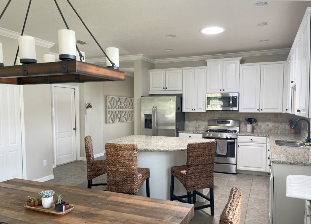 Update beige tile backsplash and floor, granite countertops, Giallo Ornamental or Venetian Gold. White Dove and ACcessible Beige, island, Kylie M Edesign