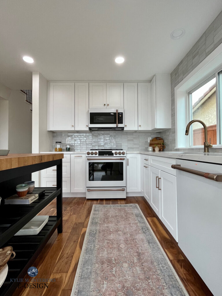 Articraft white cabinets, Asheville Cotton, CLE ZELLIGE weathered white backsplash tile, GE CAFE WHITE fridge, stove, dishwasher, brass champagne metal. Kylie M Interiors Online paint color consulting, similar to Chantilly Lace