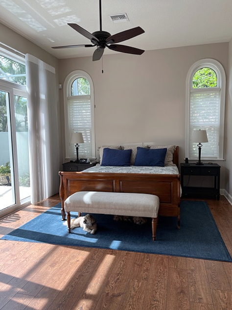 Benjamin Moore Cedar Key, red oak flooring, red stain bedroom furniture, navy blue accents, arched windows. Best beige taupe, Kylie M Interiors