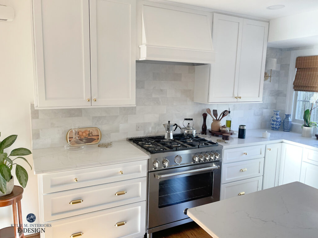 Benjamin Moore Chantilly Lace painted white kitchen cabinets, Kylie M Edesign & Truley Home collaboration,MSI Calacatta Miraggio Duo white quartz countertop, marble subway tile backsplash, stainless steel, wood floor.