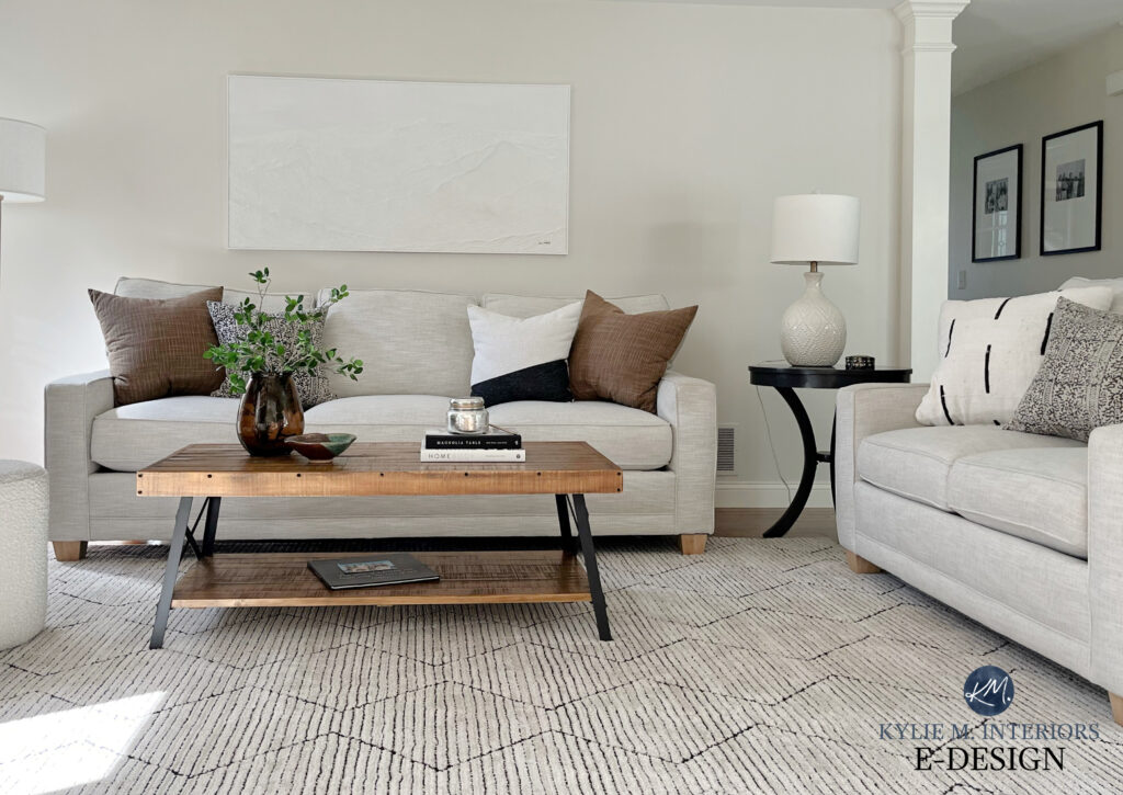 Family room or living room, taupe, greige, warm gray sofa and rug, Sherwin Williams Egret White paint color on walls, white trim, Kylie M Online paint color expert advice