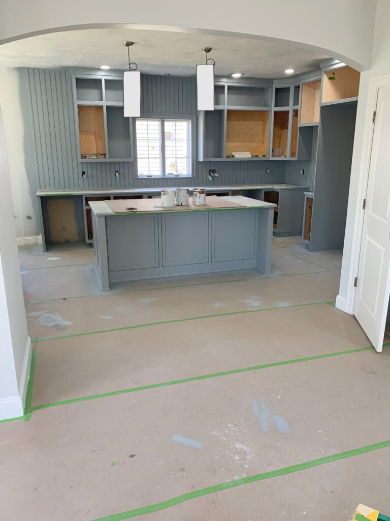 Kitchen cabinets and island in gray paint color, Sherwin Williams Uncertain Gray