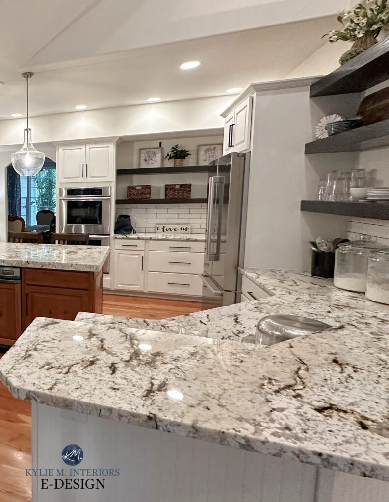Kitchen with granite countertops, painted wood cabinets with Sherwin Williams Alabaster and Creamy, wood island, subway tile. Kylie M Online paint color consultant